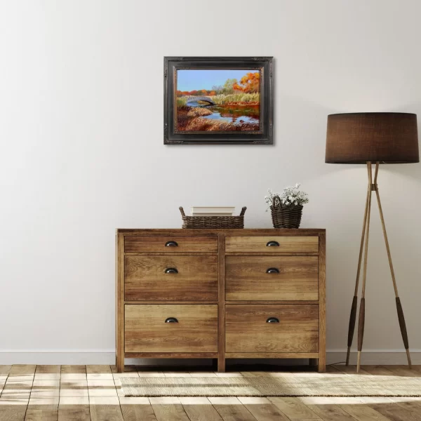 Framed painting of fall on Bellevue Pond in a coastal bedroom