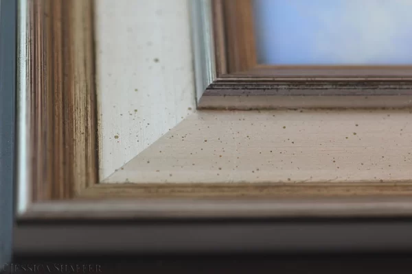 Corner detail of warm silver frame