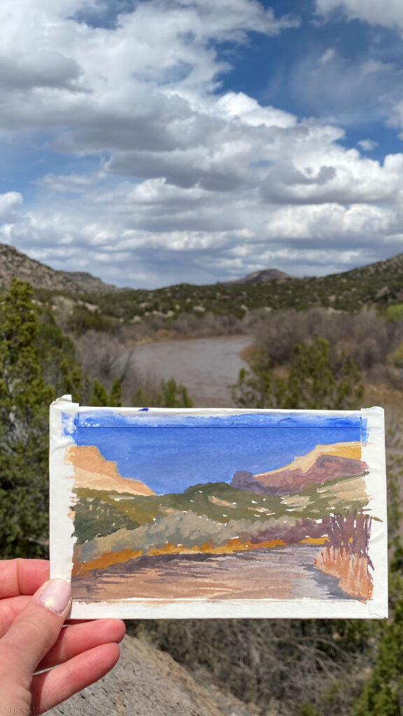 Plein air gouache painting of the Rio Grande and mountains in Los Alamos, New Mexico