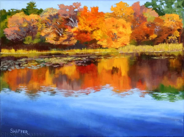 Red and yellow fall trees in a landscape oil painting of autumn trees reflecting on a pond